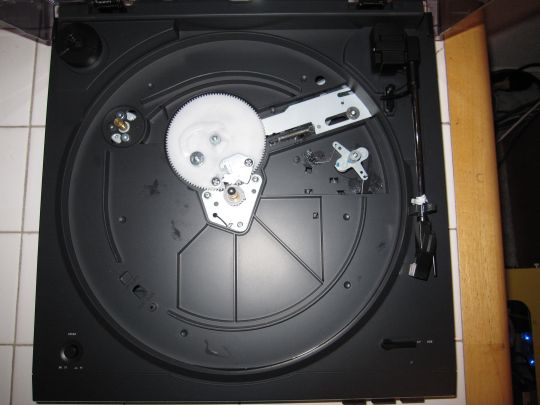Photo shows view of the Audio-Technica AT-LP2D-USB turntable unassembled turnable from above. Motor and pully are visible.