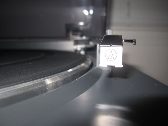 Close-up photo shows the Audio-Technica AT-3600L cartridge and stylus mounted on the tonearm of a Audio-Technica AT-LP2D-USB turnable.