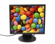 Photo of a computer monitor displaying colorful, M&M-like candy.