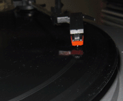 Slideshow showing the Grace turntable's bent needle ruining a record.