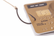 A fishing hook snares a credit card.