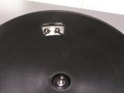 Close-up photo peering into hole in platter to see the drive belt.