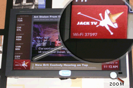 Ripple TV screen at a Jack in the Box. The Wi-Fi access code is magnified.